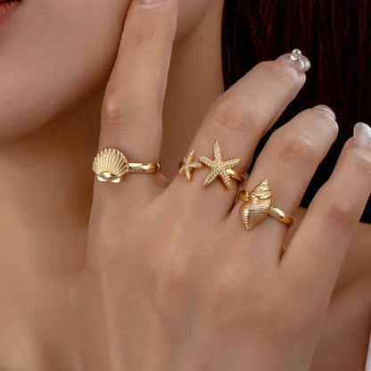 Set of 3 Gold Rings: Shell, Star, and Conch