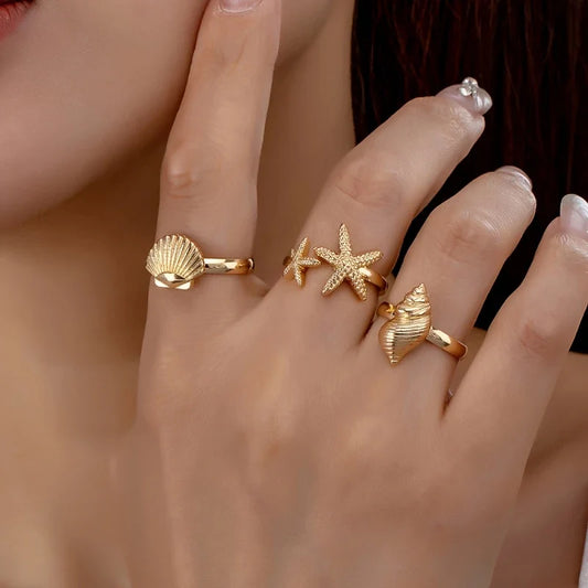 Set of 3 Gold Rings: Shell, Star, and Conch