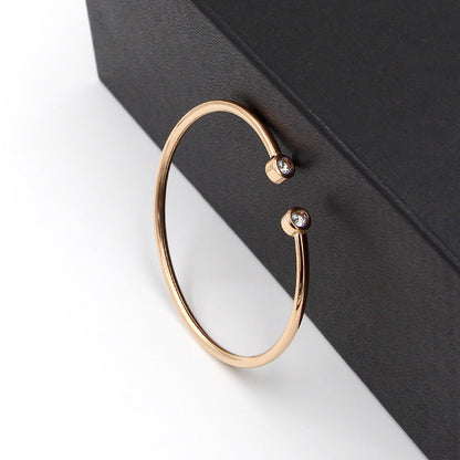 Open Gold Bracelet with Twin Crystals