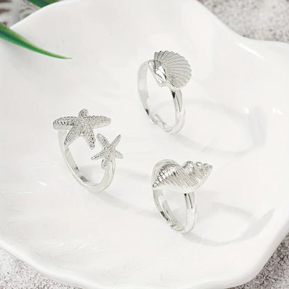 Set of 3 Gold Rings: Shell, Star, and Conch