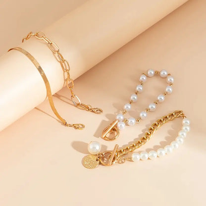Chic Gold 4-Piece Bracelet Set â€“ Snake, Pearls & Links | Gold