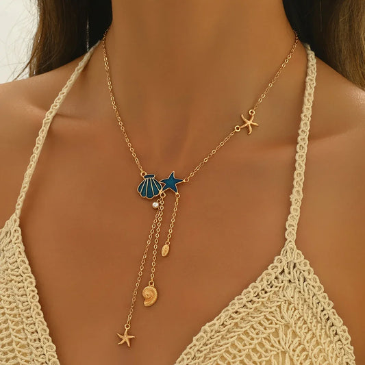 Elegant Gold Necklace with Blue Star and Shell